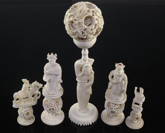 A Chinese export ivory puzzle ball and stand and four similar ivory chess pieces, 19th / early 20th century, 6.5cm - 21cm